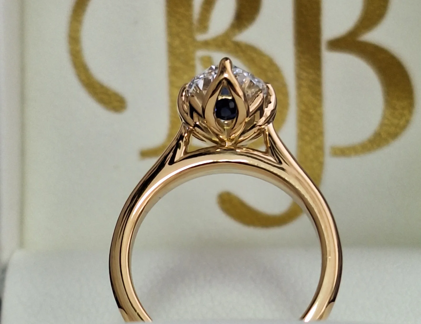 Hidden sapphire detail beneath a bespoke diamond engagement ring